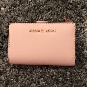 Soft pink Michael Kors leather wallet.